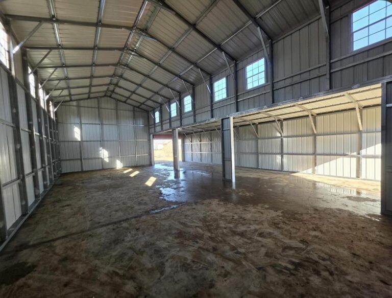 Interior framing of a steel building with daylight through the openings