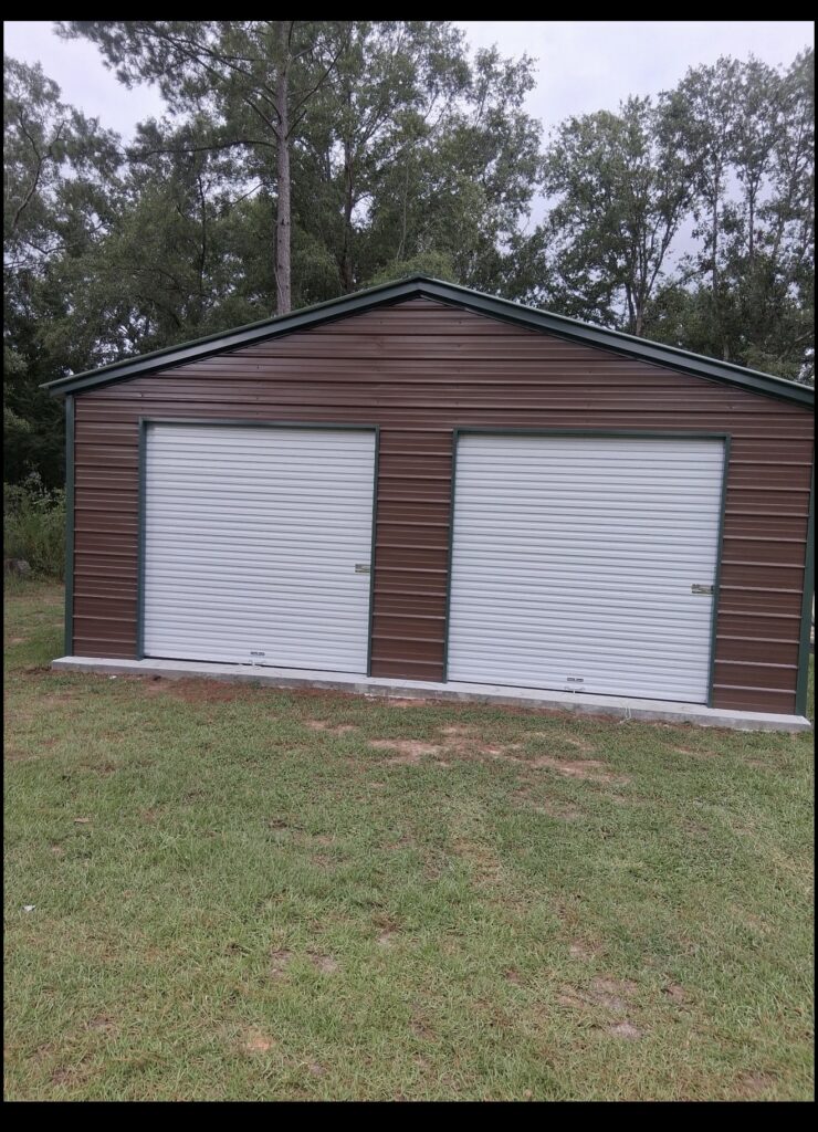 Burgundy metal garage with two white roll-up doors