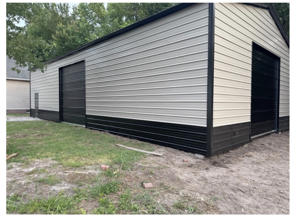 Cream steel building with black wainscot and black trim